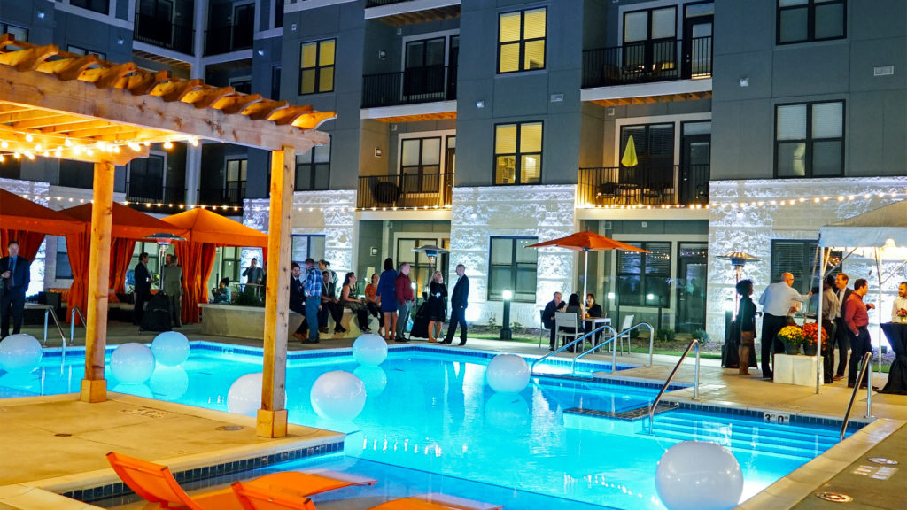 Mayfair Reserve Overview of Pool Courtyard at Night