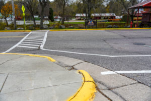 Non-compliant curb ramp has no detectable warning fields. 